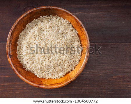 Rice in bowls on a brown background