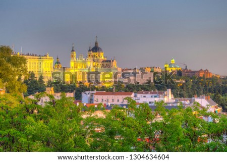 Sunset view of skyline of Madrid with Santa Maria la Real de La Almudena Cathedral and the Royal Palace, Spain
