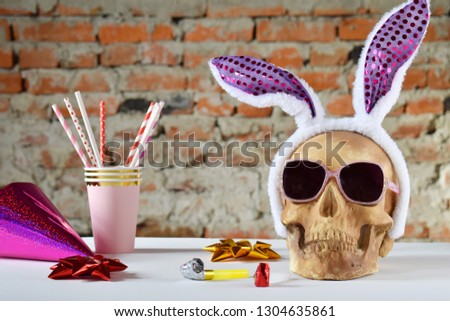 Funny skull with hair hoop in shape of rabbit ears and carnival accessories set. Decoration for party 1 April day or Mexican Day of the dead (Dia de los muertos). April fools day prank.