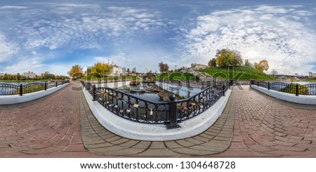 Full spherical 360 degrees angle view panorama old city near steel frame construction of bridge across river in city park in equirectangular projection. VR AR content