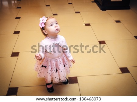 Portrait Baby dressed in pink dress