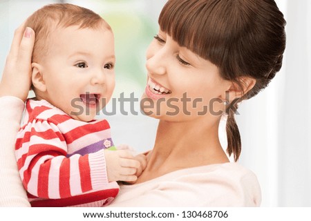 picture of happy mother with adorable baby at home