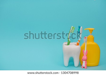 Shower accessories on a colored background. bathroom setting on blue background. means of body hygiene.