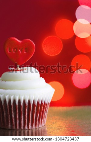 Heart in the cupcake on the love abstract defocused valentines day red background