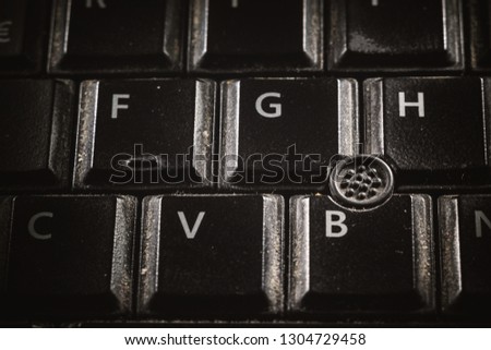 Close-up view of old and dirty black keyboard buttons. 