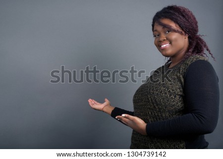 Young beautiful African American with afro hairstyle over isolated background Inviting to enter smiling natural with open hands. Welcome sign.
