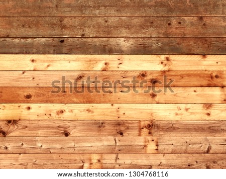 colorful old rustic wooden plank wall or floor with rich brown colored boards made of reused timber