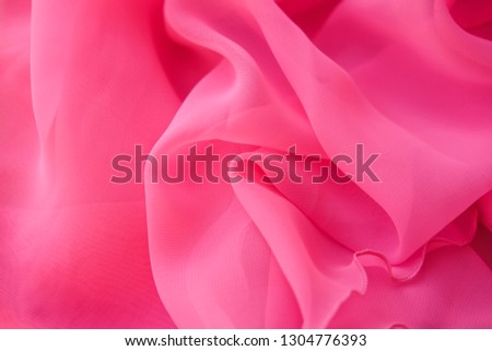 Pink georgette fabrics. The purple texture of the pleated fabric. 