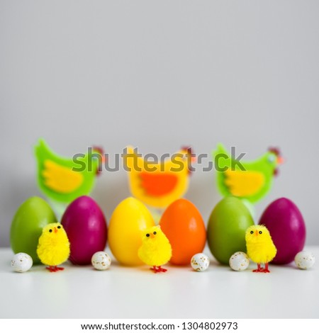 Easter background - colorful painted Easter eggs and decorations with copy space over wall