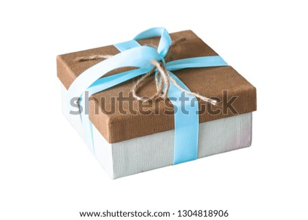 Gift box Tied with a pink ribbon close up on a white background.