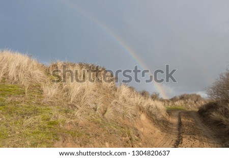 Rainbow over the Sand Dunes at Braunton Burrows on the Coast in North Devon, England, UK
