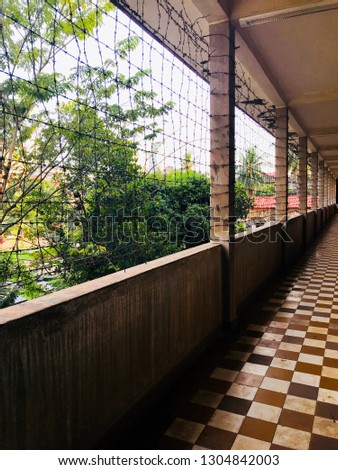 Path in one of the buildings in the Tuol Sleng Genocide museum in Phnom Penh Cambodia.