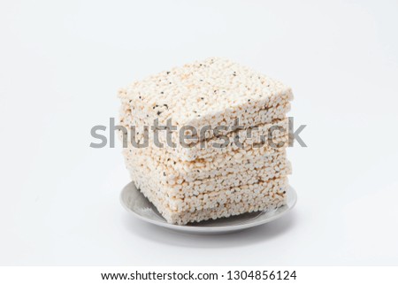 Pile of korean rice crackers isolated on white background