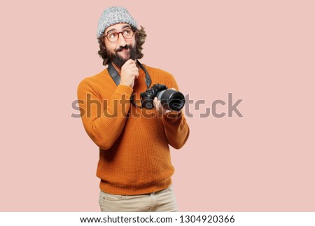 young bearded man with photo camera