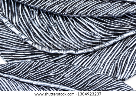 Backgrounds imitation metal. Background with a metal pattern. Decor of metal, wire, diagonally stripe, imitation of a feather. The report of the picture on the main. Background metal, silver. Selectiv