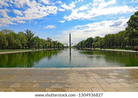 The Washington Monument and Reflecting Pool as seen from the Lincoln Memorial in Washington, DC.
