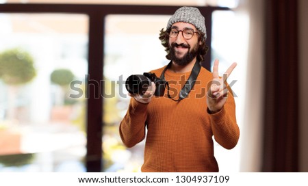 young bearded man with photo camera