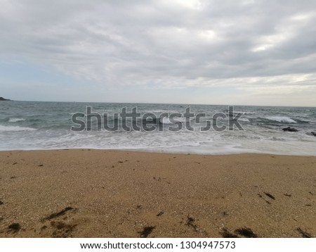 Seascape photo of a sandy shore line