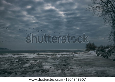 Stunning View of frozen lake Erie; Port Stanley, Ontario, Canada. Amazing Ice formations from waves crashing to shore; February 2019   