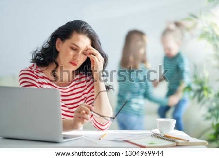 Beautiful woman working on a laptop at home.