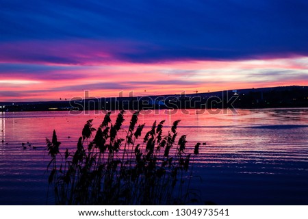 Sunset sky pink air cloud and reflection clouds beautiful sky. Sunset city background, pink clouds sunset sea.