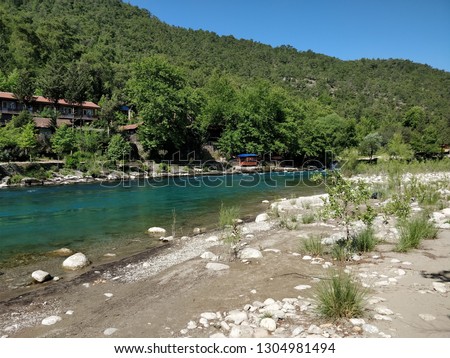 In this picture you see a calm and very clear river running through Turkey