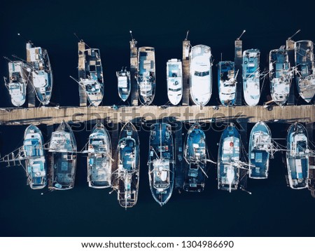 Collection of boats on a dock from up above on the central coast of Oregon