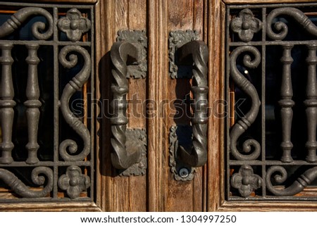 Photo of a door detail with cold colours and sunlight