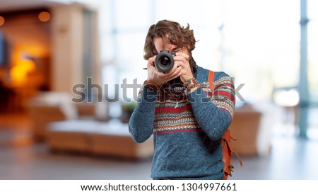 young hippie man photographer