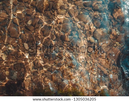 Stones under sea water, stones in the sea