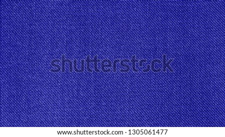 Blue woven fabric texture background. Closeup