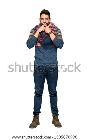 Full-length shot of Hippie man showing a sign of silence gesture on isolated white background