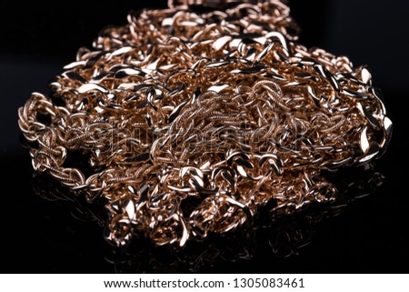 beauty, fashion. gold chain on black background