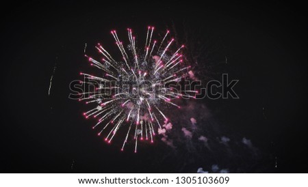 Photographing of salutes and fireworks in the night sky celebrate data. Quadcopter and salute. Powerful fireworks in the night sky.