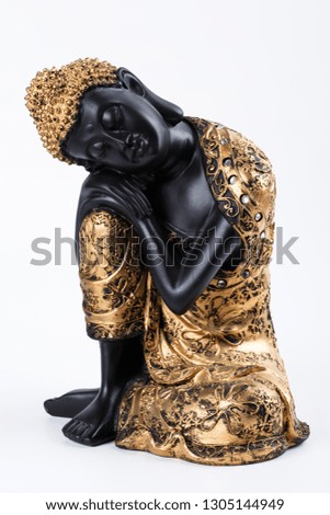 Buddhism. Buddha statuette on white background