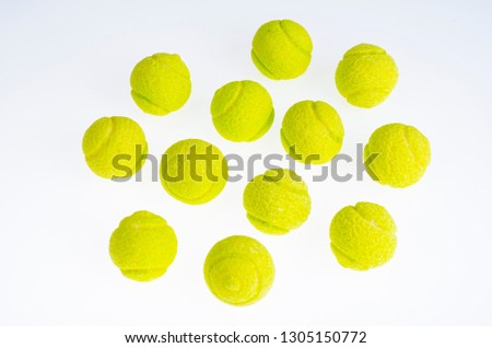 Candies gum balls in shape of tennis balls. Studio Photo Royalty-Free Stock Photo #1305150772