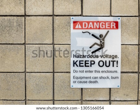 Danger, Hazardous Voltage KEEP OUT Sign