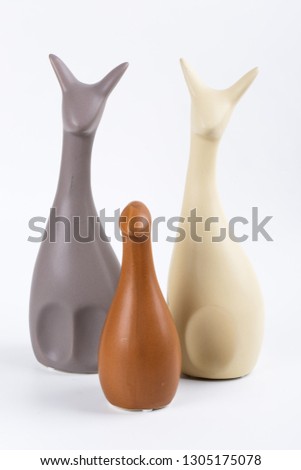 statues of cats on a white background