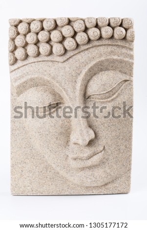 picture of plaster with the image of Buddha on a white background