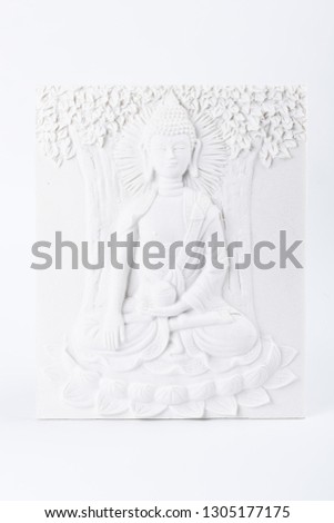 picture of plaster with the image of Buddha on a white background