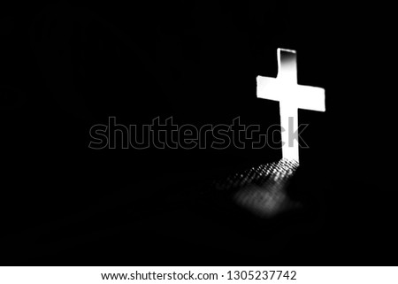 Cross with light shafts. Faith symbol. 