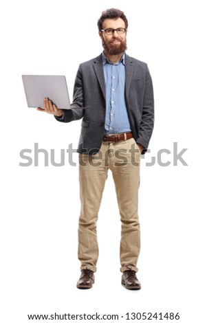 Full length portrait of a man standing with a laptop and smiling at the camera isolated on white background