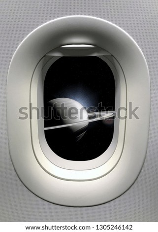 View from a porthole on the Saturn background. Elements of this image furnished by NASA.