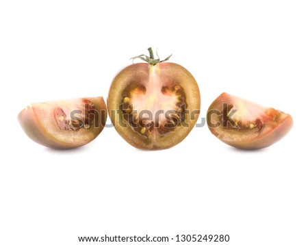 Black tomatoes Kumata.Fresh purple tomato, isolated on white