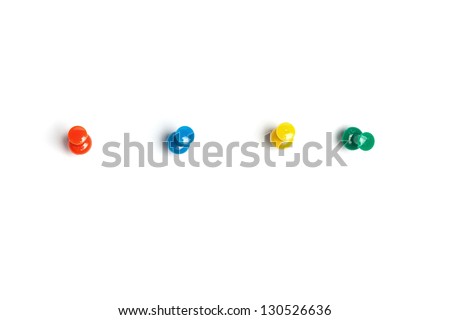 Set of push pins in different colors, with real shadows, isolated on white background. Royalty-Free Stock Photo #130526636