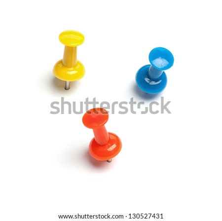 Set of push pins in different colors, with real shadows, isolated on white background. Royalty-Free Stock Photo #130527431