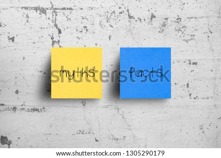 Sticky notes on concrete wall, Myths Facts Royalty-Free Stock Photo #1305290179