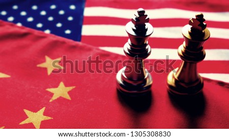Chess game. Two kings face to face on Chinese and American national flags. Trade war and conflict between two big countries. USA and China relationship concept. Copy space. Royalty-Free Stock Photo #1305308830