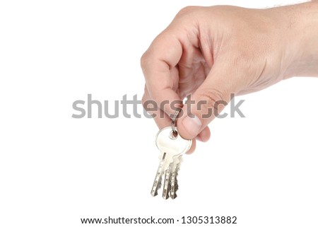 Keys from the lock in hand isolated on white background.
