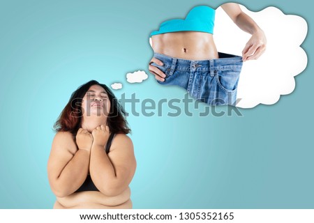 Picture of fat woman looks sad while imagining her dream to get slim body